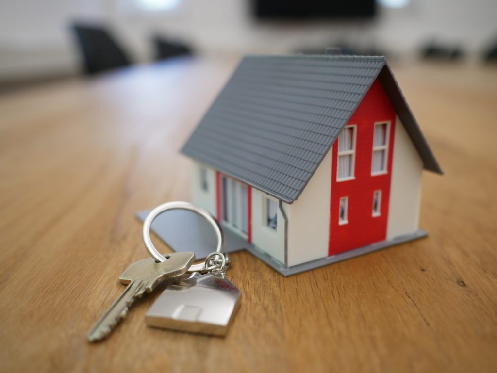 Property and Conveyancing: The keys of a recently purchased house with a house shaped keyring.